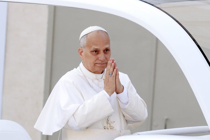 Pope Leo XIV gestures to the faithful at the end of a mass for the Jubilee of the Missionary World and the Jubilee of Migrants in St. Peter's Square at the Vatican.
