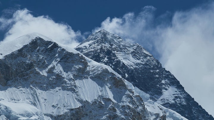 Rescuers were helping hundreds of hikers trapped by heavy snow at tourist campsites on a slope of Mount Everest.