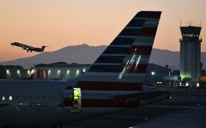 A plane takes off near the Hollywood Burbank Airport air traffic control tower (R) on Oct. 6, 2025, in Burbank, California.