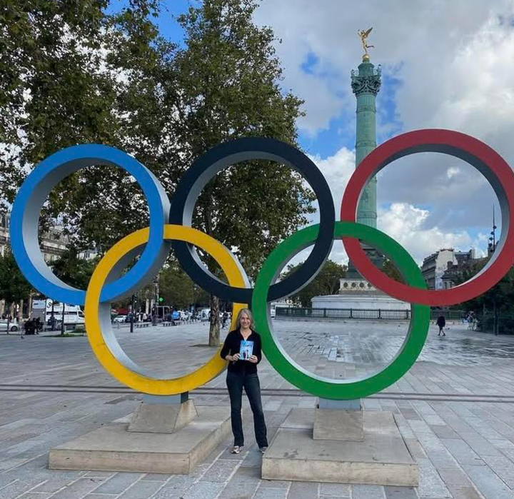 The author at the Olympic monument at Place de la Bastille in Paris.
