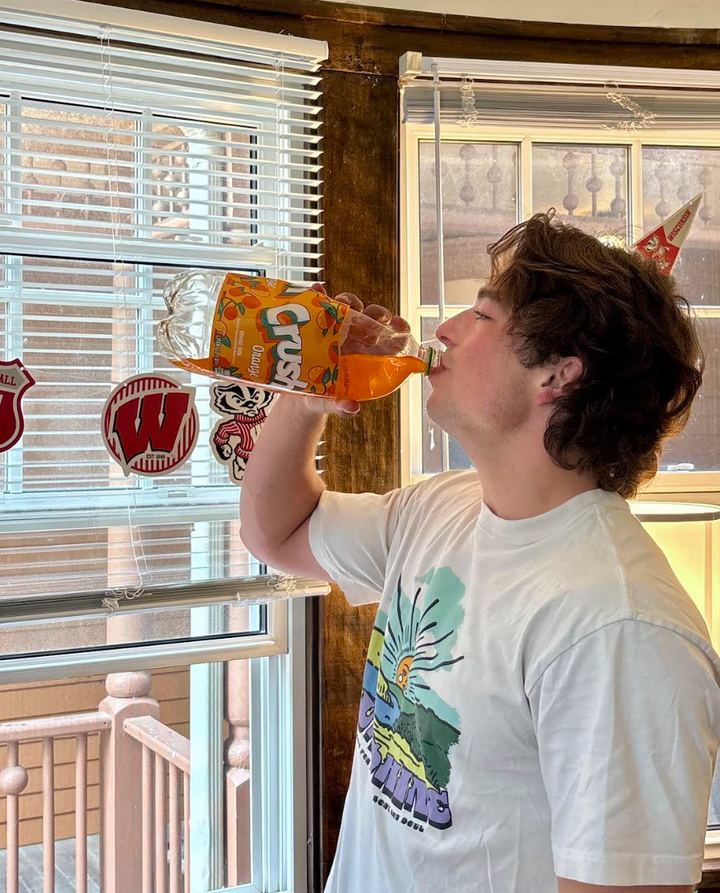 The author's son, Gavin, chugging orange soda.