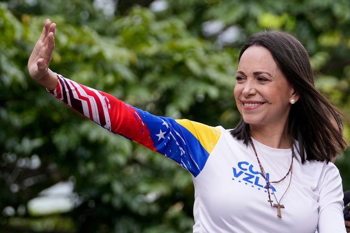 Maria Corina Machado waves from atop a truck during the closing election campaign rally for presidential candidate Edmundo Gonzalez in Caracas, Venezuela, on July 25, 2024.