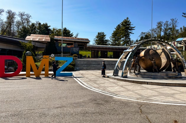Photos near the DMZ sign are encouraged, but photography in other areas is restricted.