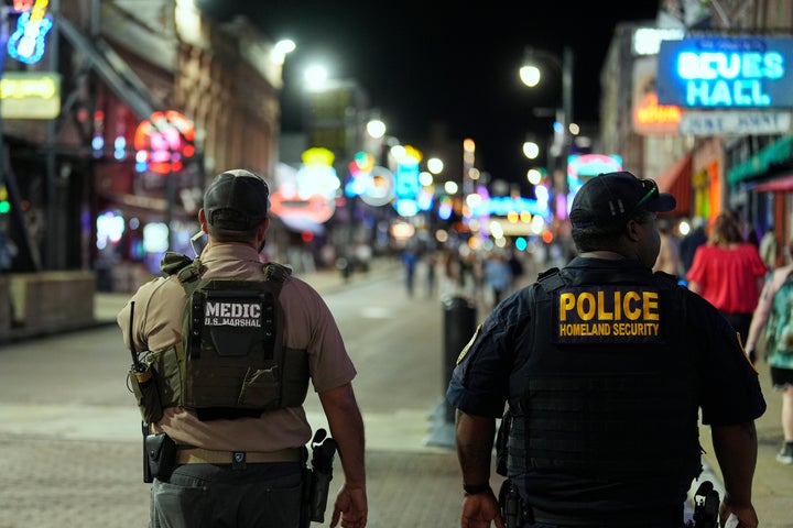 Federal law enforcement officers walk along Beale St., Wednesday, Oct. 8, 2025, in Memphis, Tenn.