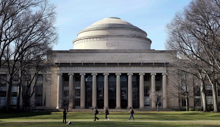 In this April 3, 2017 file photo, students walk past the "Great Dome" atop Building 10 on the Massachusetts Institute of Technology campus in Cambridge, Mass. (AP Photo/Charles Krupa, File)