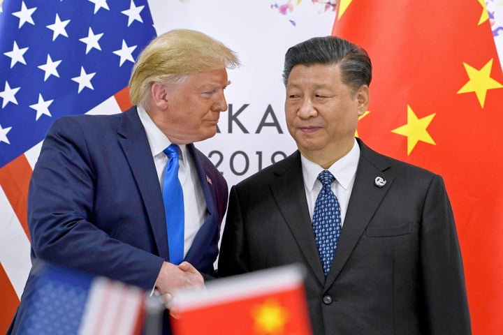 U.S. President Donald Trump, left, shakes hands with Chinese President Xi Jinping during a meeting on the sidelines of the G-20 summit in Osaka, western Japan, June 29, 2019. (AP Photo/Susan Walsh, File)