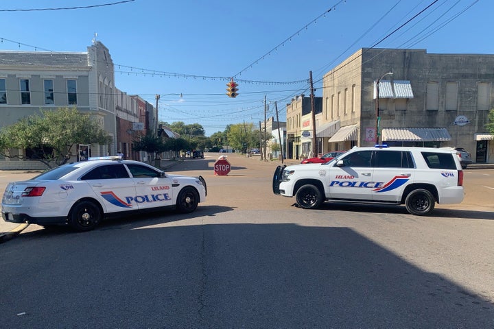 Police vehicles are parked after a deadly shooting Friday night in downtown Leland, Miss.,on Saturday, Oct. 11, 2025. (AP Photo/Katie Adkins)