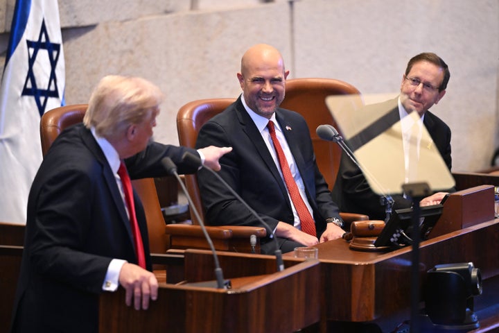 President Donald Trump points to Amir Ohana, Speaker of the Israeli Knesset, and Israeli President Isaac Herzog, as he addresses the Knesset, on Oct. 13, 2025, in Jerusalem.