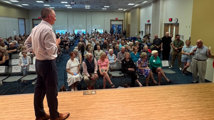 David Jolly, the likely Democratic nominee for Florida governor, takes questions from attendees to his town hall in Collier County on Monday.