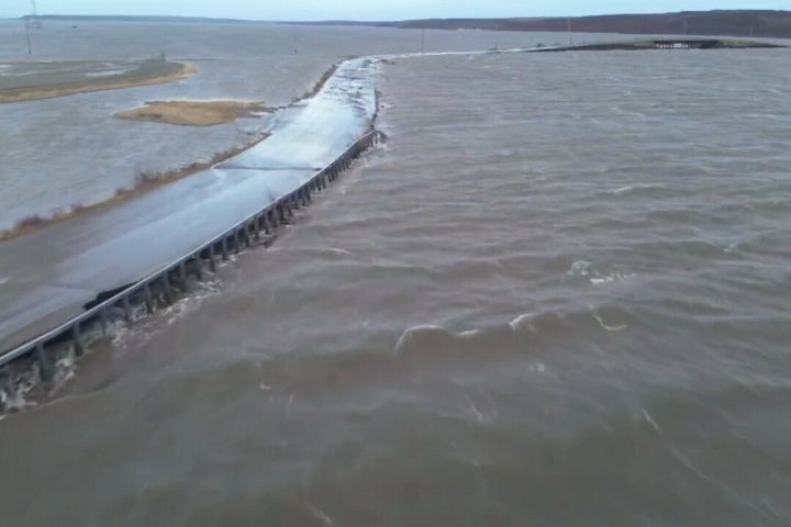 In this aerial photo provided by the Alaska Department of Transportation and Public Facilities, Ted Stevens Way, near the city of Kotzebue, Alaska, experiences flooding, Wednesday, Oct. 8, 2025. (Alaska Department of Transportation and Public Facilities via AP)