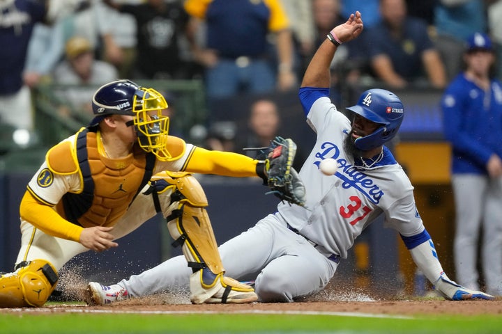 Los Angeles Dodgers' Teoscar Hernández is forced out at home by Milwaukee Brewers catcher William Contreras during the fourth inning in Game 1 of the NLCS on Monday. (AP Photo/Brynn Anderson)