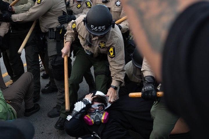 BROADVIEW, ILLINOIS - OCTOBER 11: Police and demonstrators clash during.a protest outside of the immigration processing and detention facility on October 11, 2025 in Broadview, Illinois. Demonstrations have been taking place outside of the facility for several weeks as the Trump administration's Operation Midway Blitz has been underway, arresting and detaining immigrants in the Chicago area. (Photo by Scott Olson/Getty Images)