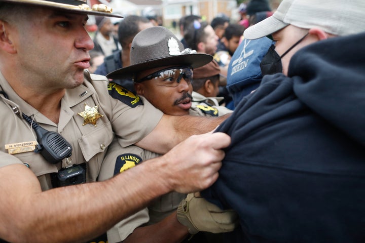 Protesters clash with state and local law enforcement near an Immigration and Customs Enforcement (ICE) detention facility in Broadview, Illinois, on October 10, 2025. A federal judge on October 9 ordered a temporary halt to President Donald Trump's deployment of hundreds of National Guard troops in the Chicago area as part of his sweeping crime and immigration crackdown. Trump's administration has argued the troops are necessary to protect immigration agents and facilities in America's third largest city, falsely depicting it as a "war zone." (Photo by OCTAVIO JONES / AFP) (Photo by OCTAVIO JONES/AFP via Getty Images) 