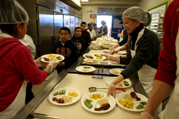 Students at Peres Elementary School pick up organic meals for lunch in Richmond, California, on Feb. 2, 2017. In a one-week pilot program, Conscious Kitchen partnered with the West Contra Costa Unified School District to serve organic meals made from scratch using ingredients sourced from local farms.