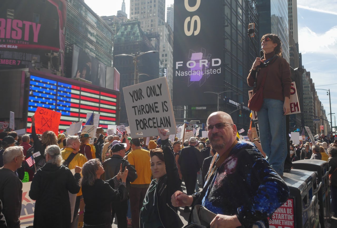 Demonstrators gathered in Times Square on Saturday for the "No Kings" protest against President Donald Trump.