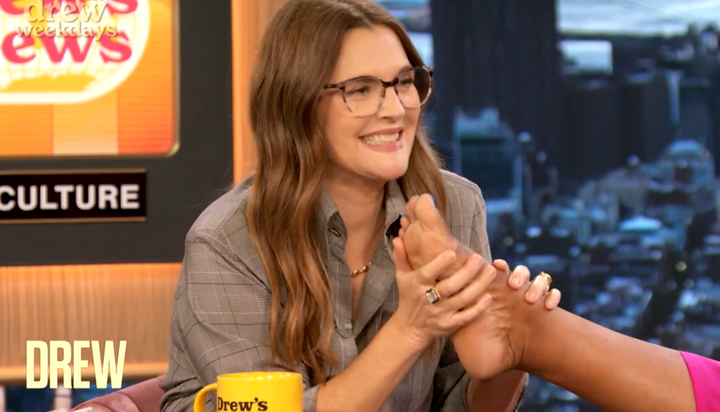 Drew Barrymore Sniffs Her Co-Hosts' Feet On Air And It Somehow Gets Stranger 1 Drew Barrymore sniffs her co-hosts' feet during a recent broadcast of her daytime talk show.