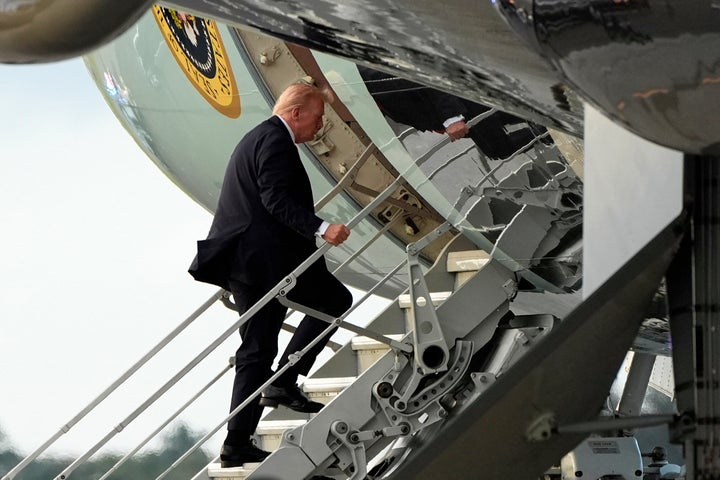President Donald Trump boards Air Force One Sunday at Palm Beach International Airport in West Palm Beach, Florida.