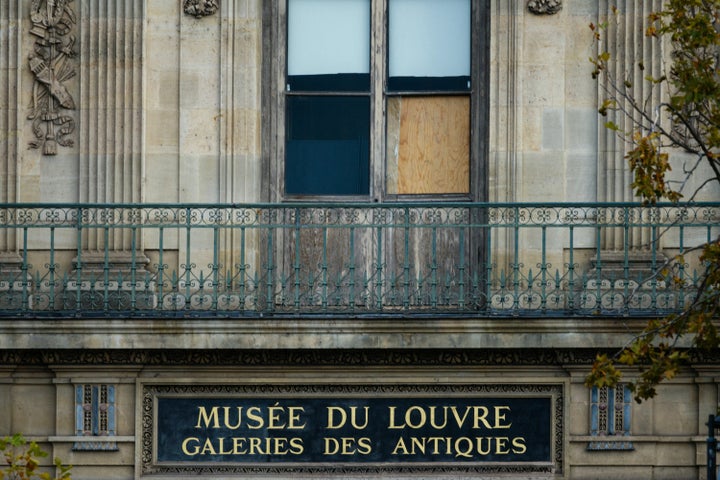 The window of the Louvre Museum is seen with the glasses covered after the thieves broke them to get in and steal priceless jewels. The museum will remain closed for the second day after the theft, in Paris on October 20, 2025. (Photo by Dimitar DILKOFF / AFP) (Photo by DIMITAR DILKOFF/AFP via Getty Images) 