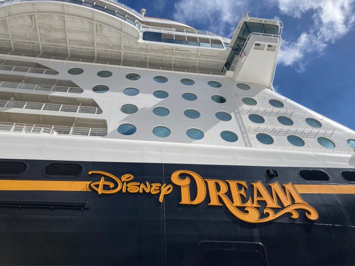 A father jumped in to save his child after she fell from the Disney Dream cruise ship. But police say the mother created the "life-threatening situation" by having their 5-year-old pose for a photo at an open porthole.