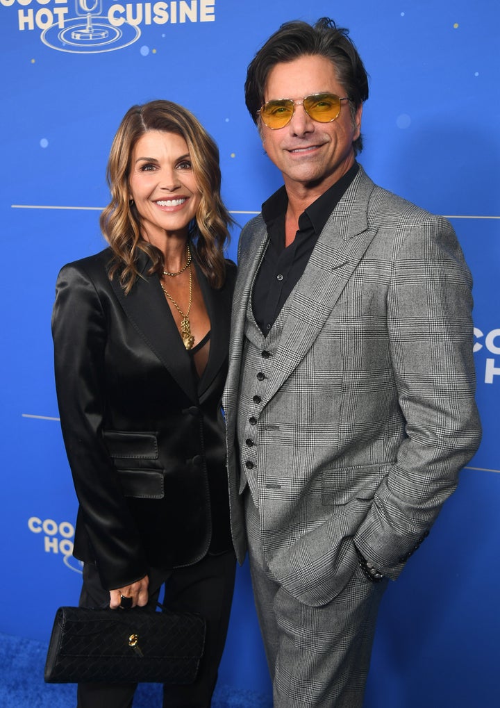 “Forty years I've known her, and you know, you can see through people after a few years ... this woman's a saint," actor John Stamos, right, said of his "Full House" and "Fuller House" co-star, Lori Loughlin.