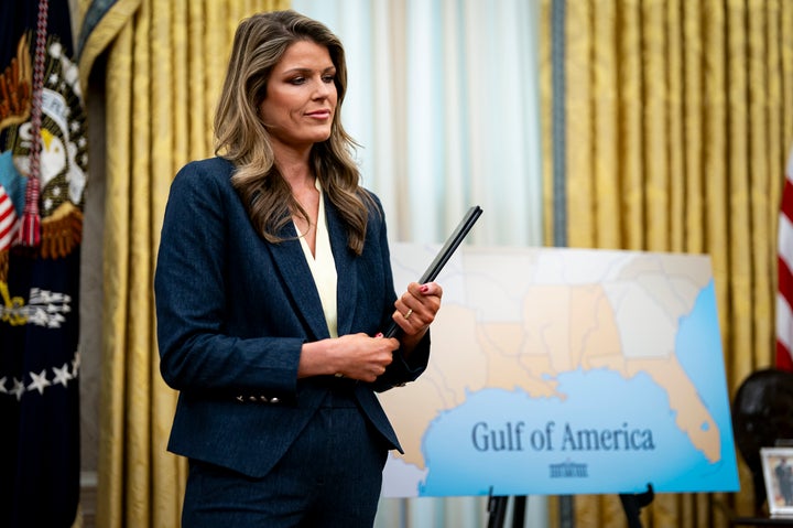 Lindsey Halligan holds ceremonial proclamations to be signed by President Donald Trump in the Oval Office of the White House, on March 6, 2025.