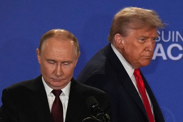 President Donald Trump, right, and Russia's President Vladimir Putin arrive for a joint press conference at Joint Base Elmendorf-Richardson, Alaska, Friday, Aug. 15, 2025. (AP Photo/Jae C. Hong)