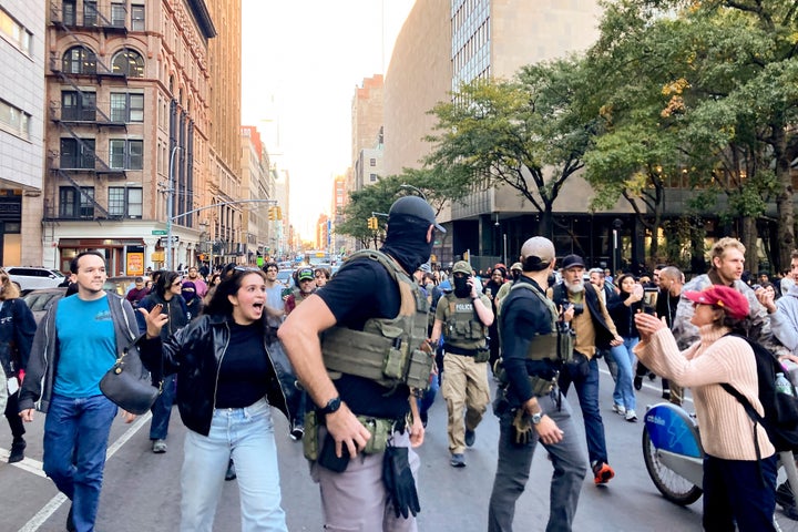 Protestors confront federal agents as they walk down Lafayette Street after an immigration sweep on Canal Street through Chinatown, on Oct. 21, 2025, in New York.