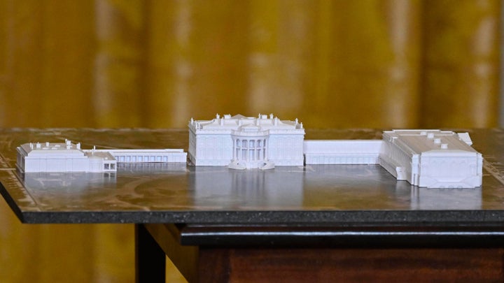 Nationwide Belief Calls For Halt To Trump's White Home Demolition 1 A model of the new White House layout is displayed as President Donald Trump addresses a dinner for donors who have contributed to build the new ballroom.