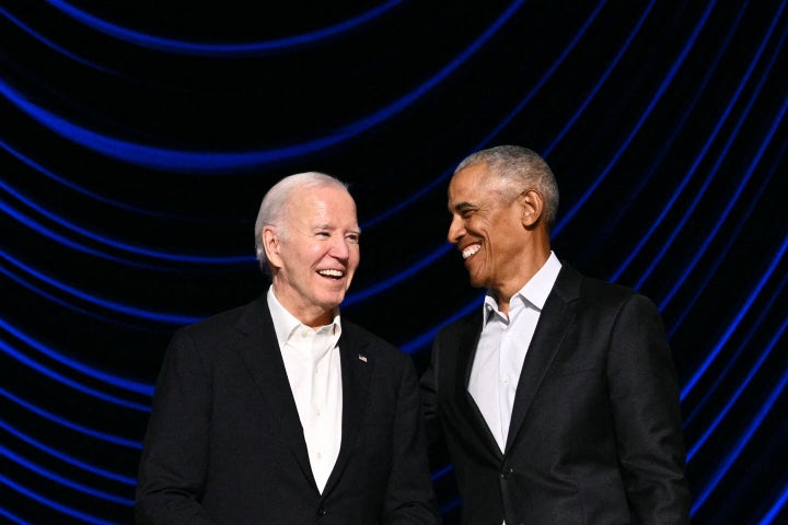 President Joe Biden laughs with President Barack Obama on stage during a campaign fundraiser at the Peacock Theater in Los Angeles on June 15, 2024.