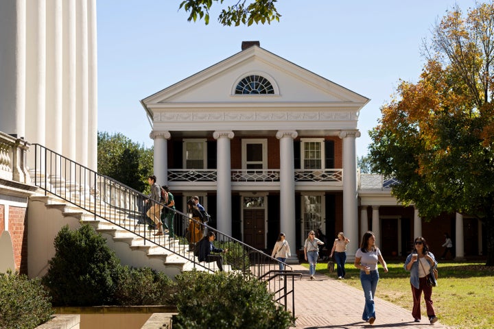 FILE - People climb steps to the Rotunda at the University of Virginia in Charlottesville, Va., Oct. 11, 2024. (AP Photo/Ryan M. Kelly, File)