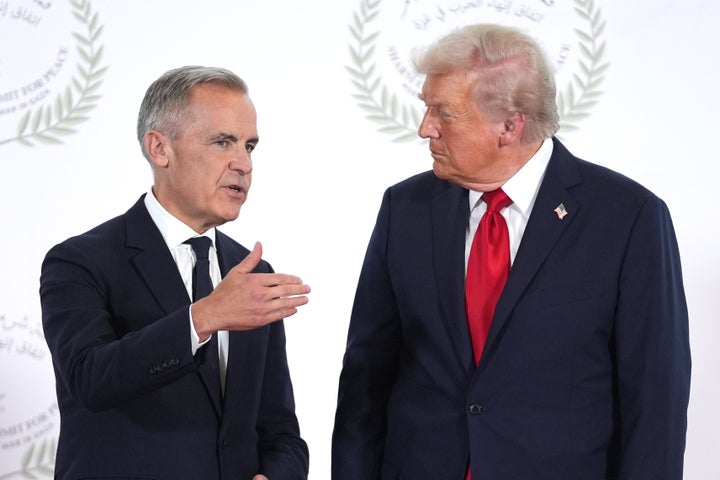 President Donald Trump greets Canada's Prime Minister Mark Carney during a world leaders' summit on ending the Gaza war on October 13, 2025 in Sharm El-Sheikh, Egypt. (Photo by Evan Vucci - Pool / Getty Images)