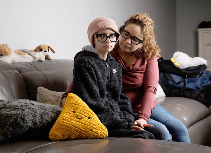 Ofelia Torres, 16, left, and her mother, Sandibell Hidalgo, 40, at their home on Oct. 20, 2025, in Chicago. Torres' father and Hidalgo's husband, Ruben Maldonado, was taken by Immigration and Customs Enforcement officers over the weekend. Torres was diagnosed with rhabdomyosarcoma cancer in Dec. 2024. (Armando L. Sanchez/Chicago Tribune/Tribune News Service via Getty Images)