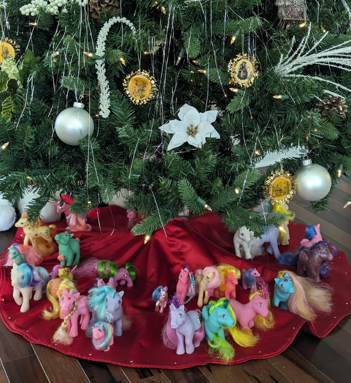 The author's collection of ponies from childhood under the Christmas tree in 2023.