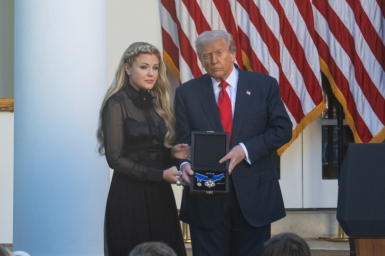President Donald Trump presents the Presidential Medal of Freedom to Erika Kirk during a ceremony to posthumously award the medal to Charlie Kirk, in the Rose Garden of the White House, in Washington, D.C., Oct. 14, 2025. 