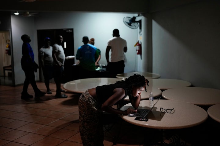 A woman video chats with a friend ahead of Hurricane Melissa's forecast arrival in Kingston, Jamaica, on Oct. 27, 2025.