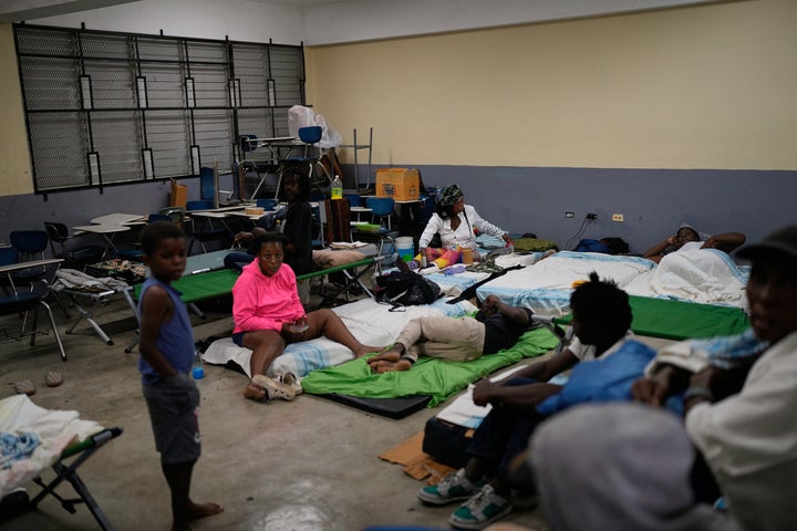 People take shelter in a school ahead of Hurricane Melissa's forecast arrival in Old Harbour, Jamaica, on Oct. 27, 2025.
