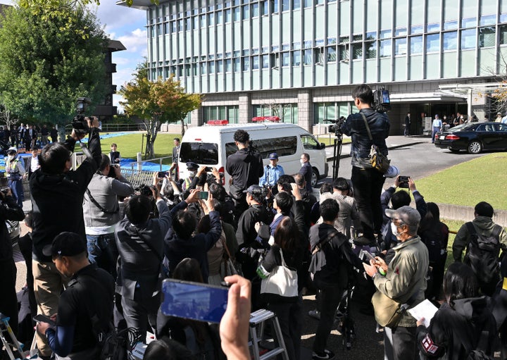 A car believed to be carrying defendant Tetsuya Yamagami enters the Nara District Court for his first trial in Nara, Nara Prefecture on Oct. 28, 2025.