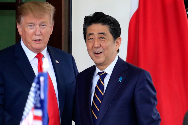 In this April 26, 2019, file photo, Japanese Prime Minister Shinzo Abe, right, is welcomed by U.S. President Donald Trump to the White House in Washington.