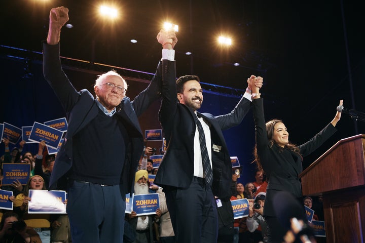 New York Mayoral Candidate Zohran Mamdani, center, celebrates with Sen. Bernie Sanders (I-VT), left, and U.S. Rep. Alexandria Ocasio-Cortez (D-N.Y.), right, during an election rally on Sunday in Queens, New York City.