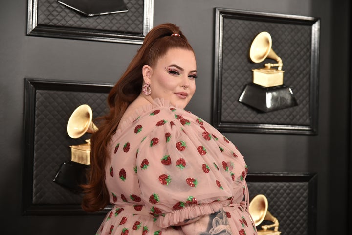 The model explained she was "was trying to be polite because I'm traveling with my child."