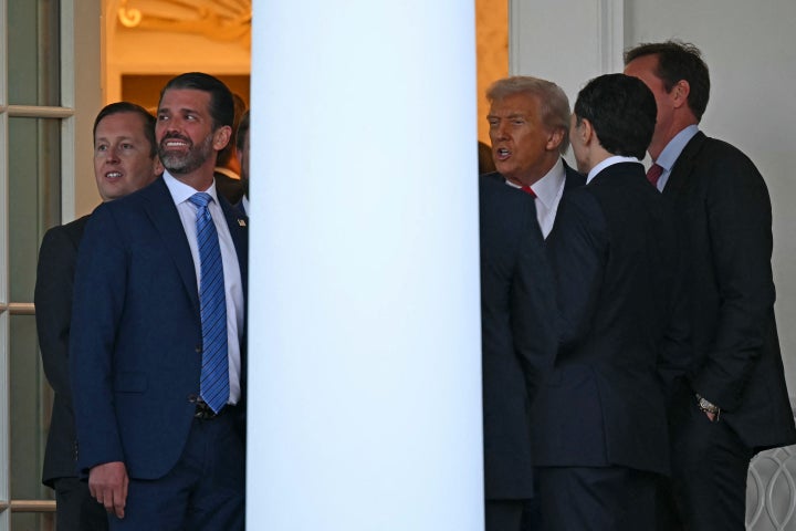 Donald Trump Jr. (L) and US President Donald Trump (3rd R) are seen at the end of a Medal of Freedom Ceremony for late US right-wing activist Charlie Kirk in the Rose Garden of the White House in Washington, DC, on October 14, 2025. (Photo by ANDREW CABALLERO-REYNOLDS/AFP via Getty Images)