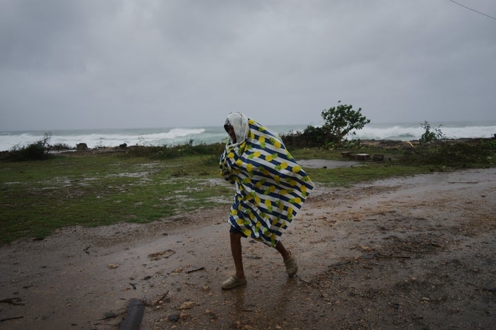 A man walks in the rain before the arrival of Hurricane Melissa in Canizo, a village in Santiago de Cuba, on Oct. 28, 2025.