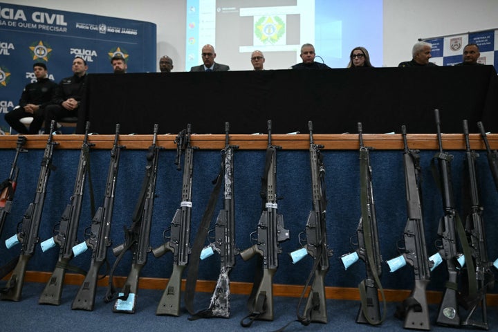 Assault rifles seized during the Operacao Contencao (Operation Containment) in the Penha Complex are displayed during a press conference at the Civil Police headquarters in Rio de Janeiro, Brazil, on October 29, 2025. (Photo by MAURO PIMENTEL/AFP via Getty Images)