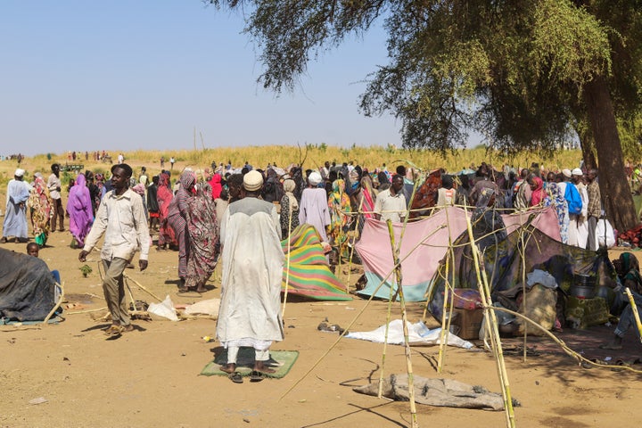 Sudanese who fled el-Fasher city, after Sudan's paramilitary forces killed hundreds of people in the western Darfur region, gather at their camp in Tawila, Sudan, Wednesday, Oct. 29, 2025. (AP Photo/Muhnnad Adam)