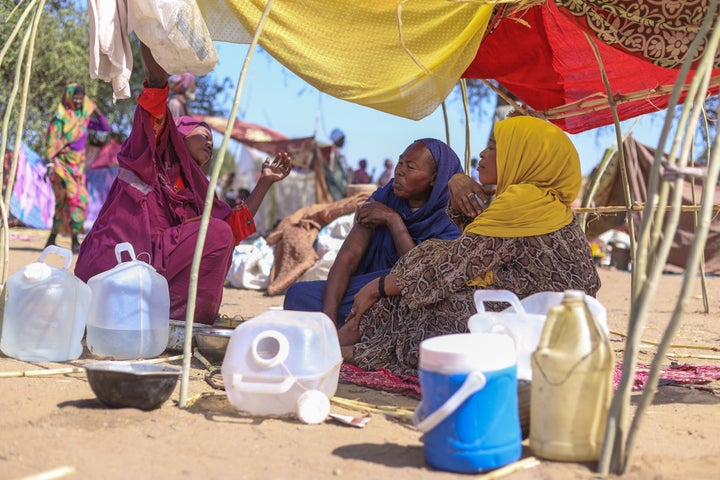 Sudanese who fled el-Fasher city, after Sudan's paramilitary forces killed hundreds of people in the western Darfur region, speak at their camp in Tawila, Sudan, Wednesday, Oct. 29, 2025. (AP Photo/Muhnnad Adam)