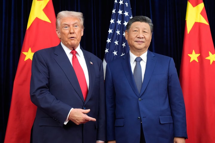 Trump Cuts Tariffs On China After Assembly Xi In South Korea 1 President Donald Trump, left, and Chinese President Xi Jinping, right, pose for photo before their meeting at Gimhae International Airport in Busan, South Korea, on Oct. 30, 2025.