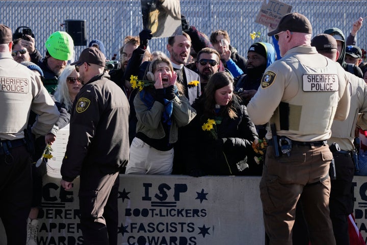 Protesters gather outside an ICE processing facility in Broadview, Ill. a suburb of Chicago, Friday, Oct. 24, 2025. (AP Photo/Nam Y. Huh)