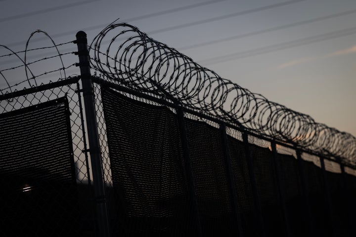 Advocates Allege ‘Inhumane’ Situations At Chicago-Space ICE Facility In New Lawsuit 1 Concertina wire sits atop a fence surrounding an immigration processing center on September 22, 2025 in Broadview, Illinois. (Photo by Scott Olson/Getty Images)