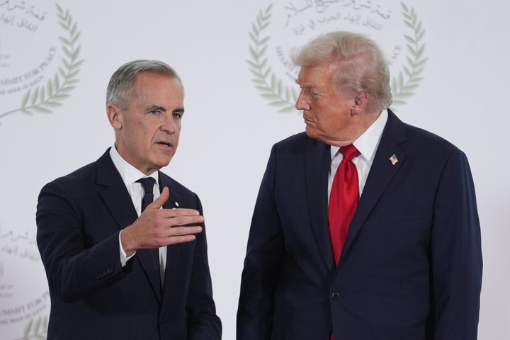 President Donald Trump greets Canada's Prime Minister Mark Carney during a summit to support ending the more than two-year Israel-Hamas war in Gaza after a breakthrough ceasefire deal, Monday, Oct. 13, 2025, in Sharm El Sheikh, Egypt. (AP Photo/Evan Vucci, Pool)