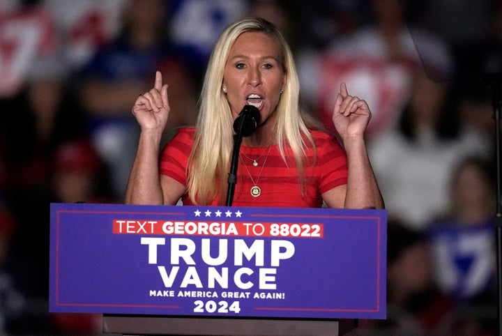 Greene, seen here campaigning for Trump last October, maintained her loyalty to him Friday.